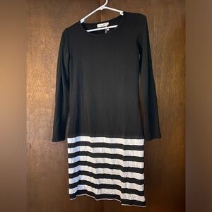 Vintage long sleeve dress.  Black body w/ black&white striped skirt. Large